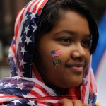 NEW YORK - SEPTEMBER 26: Aliza Fatima, 12, of Queens and a descendent of Pakistani parents, participates in the American Muslim Day Parade on September 26, 2010 in New York, New York. The annual parade celebrates the presence and contributions of Muslims in New York City and surrounding areas. The parade, which attracts hundreds of participants, concludes with a bazaar selling food, clothing, and books from various Muslim nations. (Photo by Spencer Platt/Getty Images)